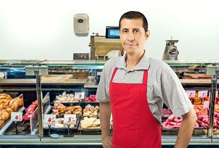 butcher standing by his fresh product