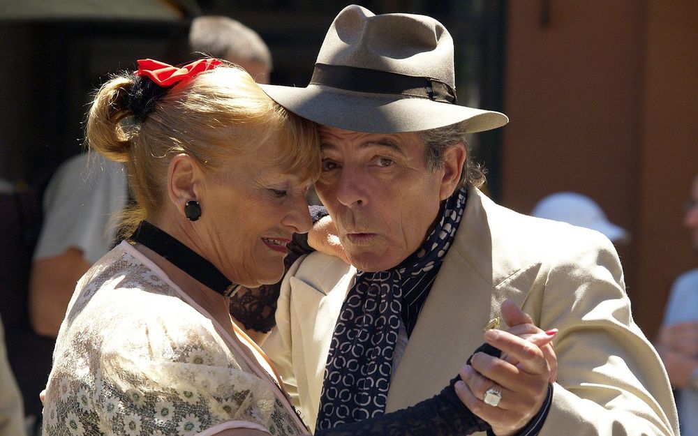 Elderly couple dancing under the sun