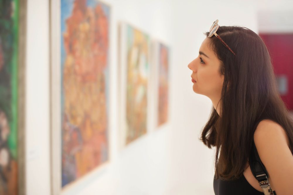 Woman looking at art piece at local gallery Canada