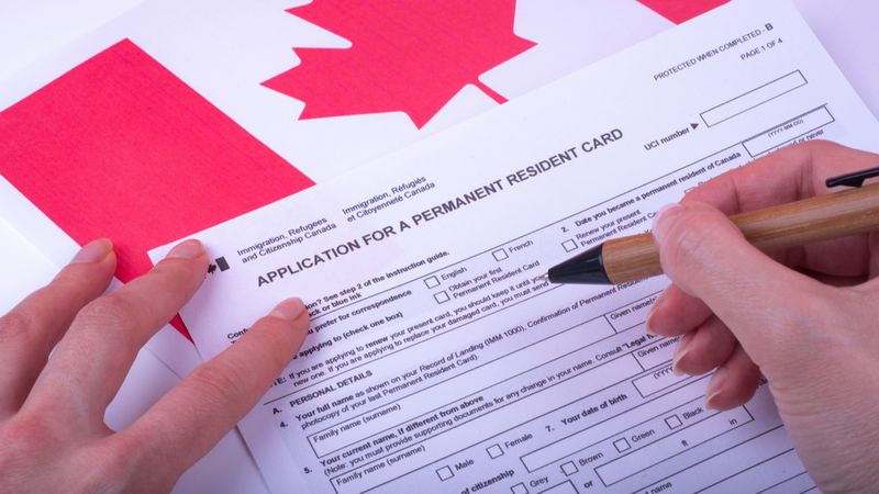 immigration-application-being-filled-out-how-to-immigrate-to-canada-in-2021