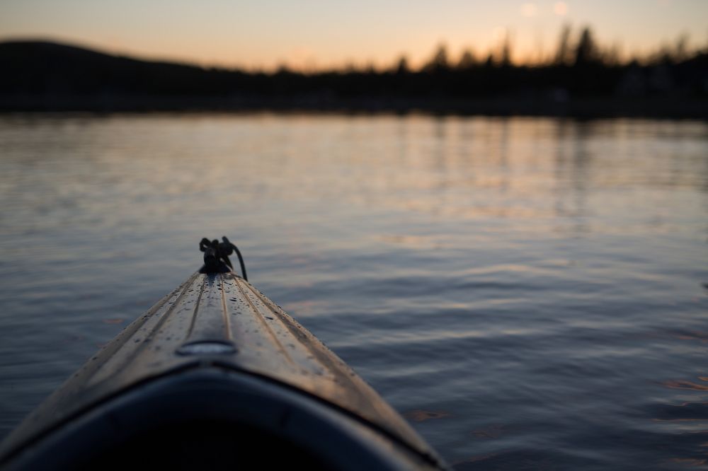 Calgary - The wild west canoe on lake waters at sunset