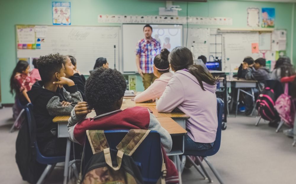 Education in Calgary high school students listening to teacher in class