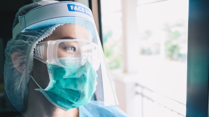 6 New Canadian Immigration Programs to be Launched! Nurse wearing PPE | Canadian Immigration Programs