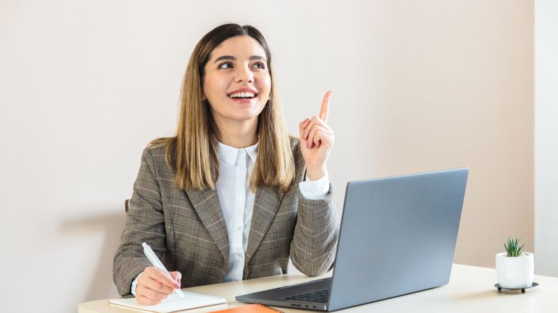 young woman thinking of things to include in her cover letter | jobs in Canada